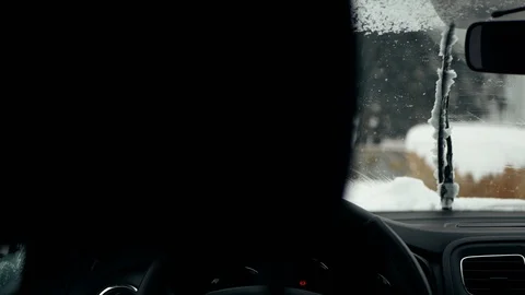 Winter sleet and drops and sleet sticking. Car windshield wipers clean  Stock Footage 112093438
