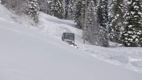 Winter Small Snowcat Drives Along Mountain Path Stock Footage 154071453