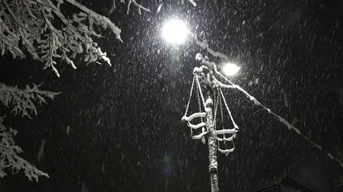 Winter snow blizzard at night with light post Video stock 73500457