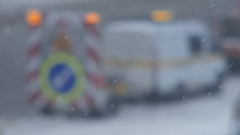 Winter. Snow Falling. Road Works Car &amp; Sign on Background. 動画素材 87247056