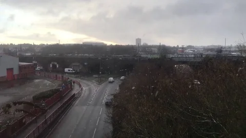 Winter Snow falls onto a fast-paced Urban Skyline Stock-Footage 84676794