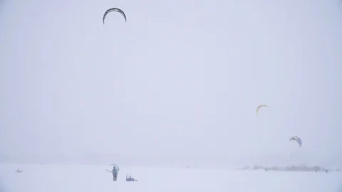 Winter snow kiting on the winter field. Snowfall Stock Footage 86995826