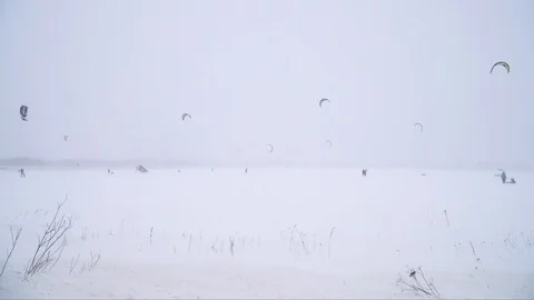 Winter snow kiting on the winter field. Snowfall Stock Footage 86995844