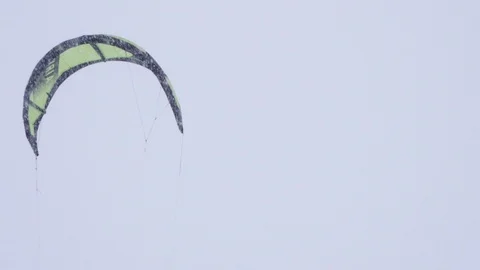 Winter snow kiting on the winter field. Snowfall Stock Footage 86995937