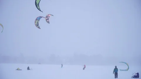 Winter snow kiting on the winter field. Snowfall Stock Footage 86996394