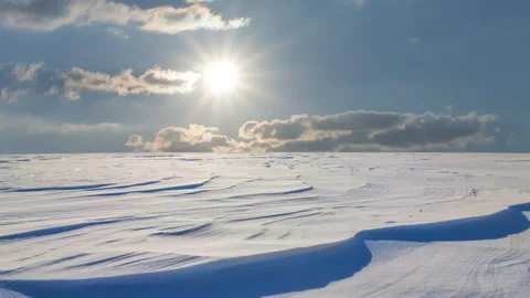 Winter snowbound plain in light of sparkle sun time lapse scene Stock Footage 250763778
