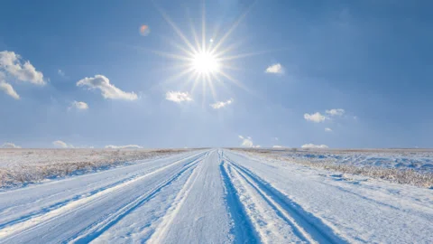 Winter snowbound plain under a sparkle sun 스톡 동영상 312372282