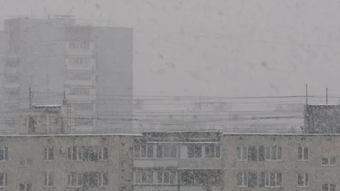 Winter Snowfall High-Rise Building In City Stock Footage 77486182