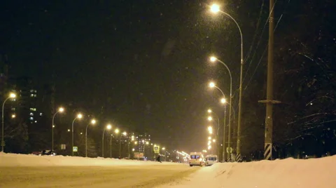 Winter snowfall on the street at night. Stock Footage 68412490