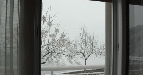 Winter snowfall. Tracking shot exiting to the balcony - slow motion 4K Stock Footage 150830740