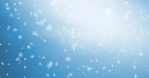 Winter snowflakes motion on blue sky bac... | Stock Video | Pond5