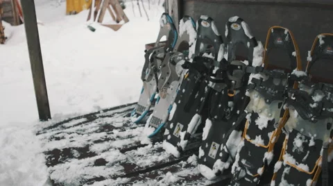 Winter Snowshoes lined up on a bench. Stock Footage 59787410
