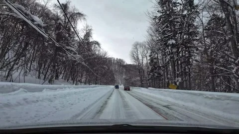Winter snowy road driving left straight right curve with traffic Japan 스톡 동영상 333204992