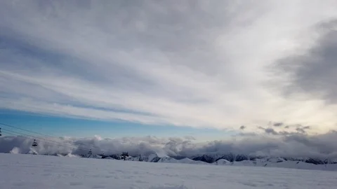 Winter snowy timelapse in mountains at cloudy weather Stock Footage 103999421