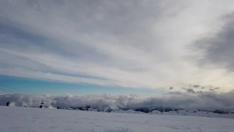 Winter snowy timelapse in mountains at cloudy weather Stock Footage 104087407