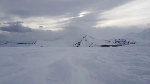 Winter snowy timelapse in mountains at cloudy weather Stock Footage 104087638
