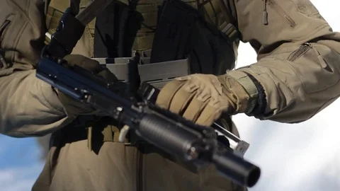 In winter, the soldier puts the weapon on guard, unfolds the store, inserts it i Stock Footage 83176234