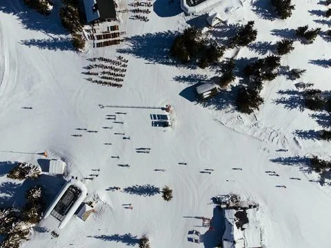 Winter sports: top view of people skiing in a ski resort in Kopaonic, Serbia Stock Photos