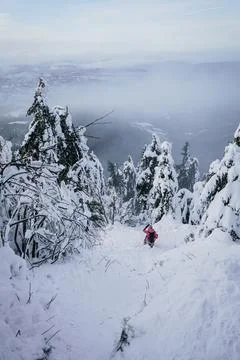 Winter Steep Slope Path Down the Mountain with Snow and person Stock Photos