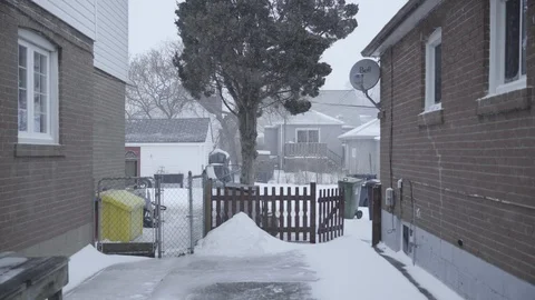 Winter storm back yard. driveway of house Stock Footage 102919833