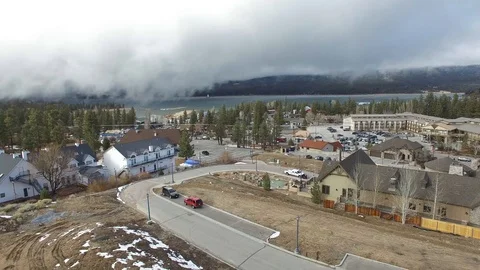 Winter storm clouds drifting over mountain town Stock Footage 86889592