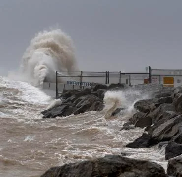 Winter Storm Generated Wave Crashing Into Break Wall Stock Photos