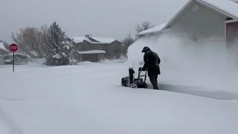 Winter Storm - Man clearing sidewalks during a snow storm with more than 20 inch 스톡 동영상 233921796
