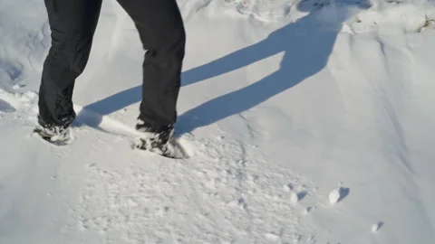 Winter Stroll: Dark Pants and Boots in Fresh Snow Stock Footage 303072804