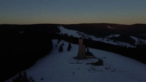 Winter Sunfall at the Tower – Aerial View of Snowy Serenity Stock Footage 319446196