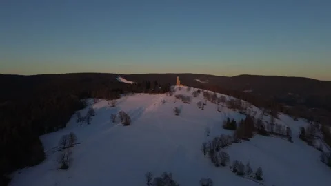Winter Sunfall at the Tower – Aerial View of Snowy Serenity 2 Stock Footage 319446281