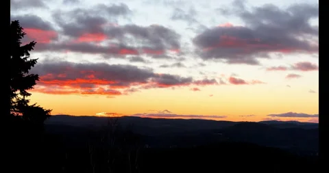 Winter Sunrise over Mountains with Fast Moving Clouds Time Lapse Stock Footage 296644101