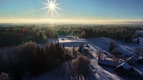 Winter sunrise over snowy forest landscape in Latvia 스톡 동영상 331069771