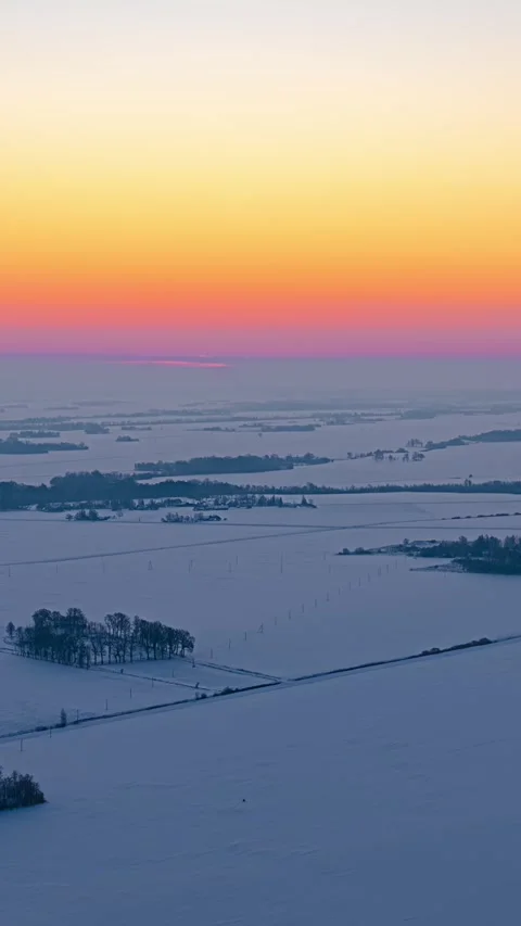 Winter Sunrise Timelapse Over Snow Covered Farmland in Latvia Stock Footage 342842151