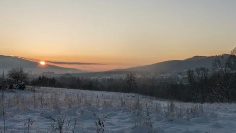Winter Sunrise timelapse with a sun behind the mountain Stock Footage 101736838