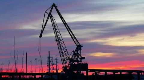 Winter sunset and crane in the port. Video stock 59795335