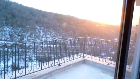 Winter Sunset Balcony: Warm Glow Snowfall Stock Footage 306574052