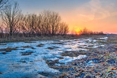 Winter sunset in the field Stock Photos