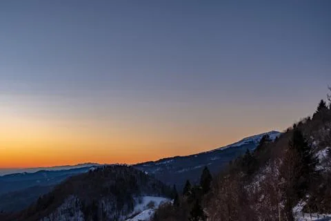 Winter sunset in the hills of Slovenia Stock Photos