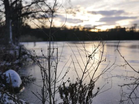 Winter Sunset at a Lake Stock Photos