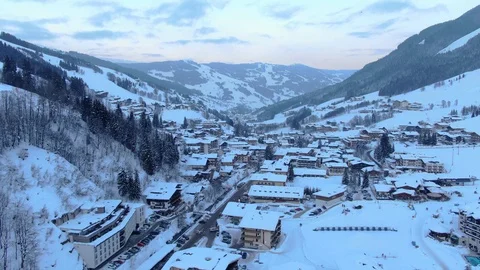 Winter Sunset  Mountain view in  Austria Europe camera flying over Ski Resort Stock Footage 104232314