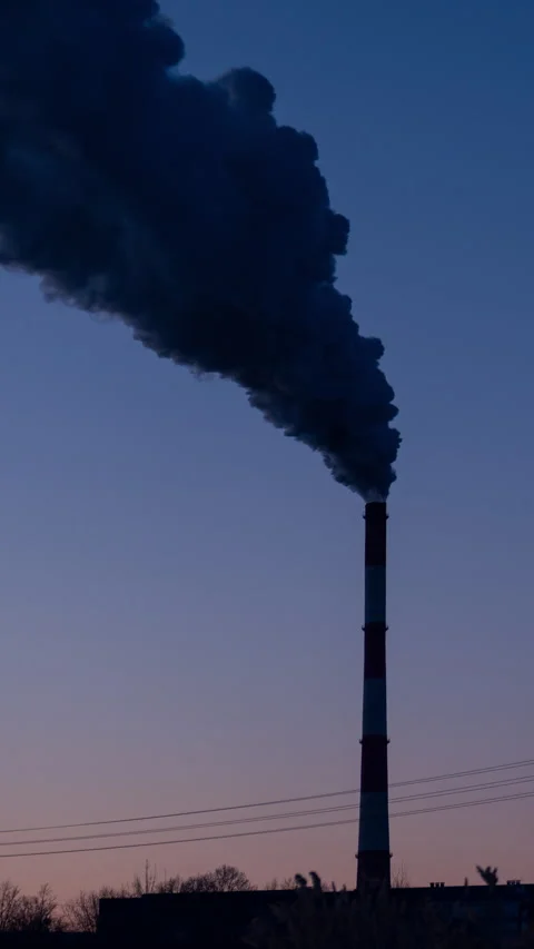 Winter sunset over a coal-fired power plant Video stock 327690092