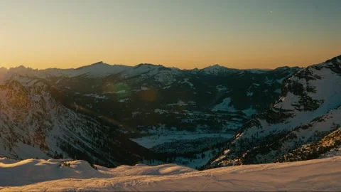 Winter Sunset over Mountain Cabin Valley in Snowy Alpine Landscape Scenery Stock Footage 331170308