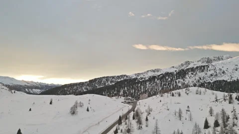 Winter sunset over snowy alpine pass in the Dolomites, Italy Stock Footage 318777434