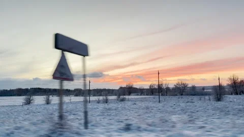 Winter sunset over snowy fields, Cold winter evening landscape, Snow-covered Stock Footage 314684631