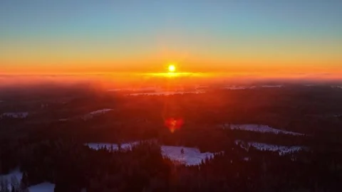 Winter sunset over snowy forest landscape aerial view Stock-Footage 331069642
