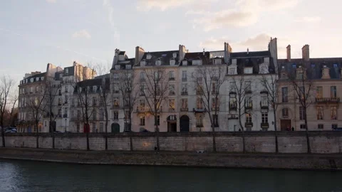 Winter Sunset on Seine River Facing Parisian Buildings in Paris, France Stock Footage 258890687