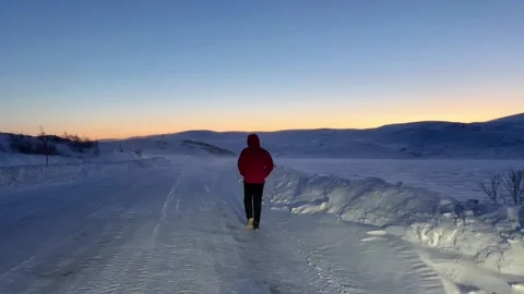 Winter Sunset Stroll in Crimson Coat Stock Footage 256236347