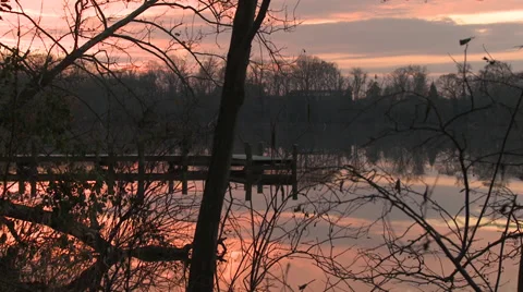 Winter Sunset Time Lapse Over Dock On River 스톡 동영상 33046724