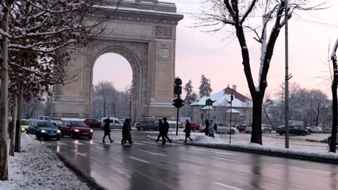 Winter sunset, traffic, at The Arch Of Triumph, Bucharest, Romania Stock Footage 144136797