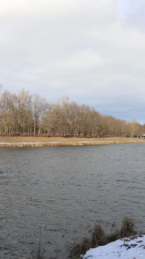 Winter swimmers training on a long cold river endurance route outdoors Stock Footage 329632747